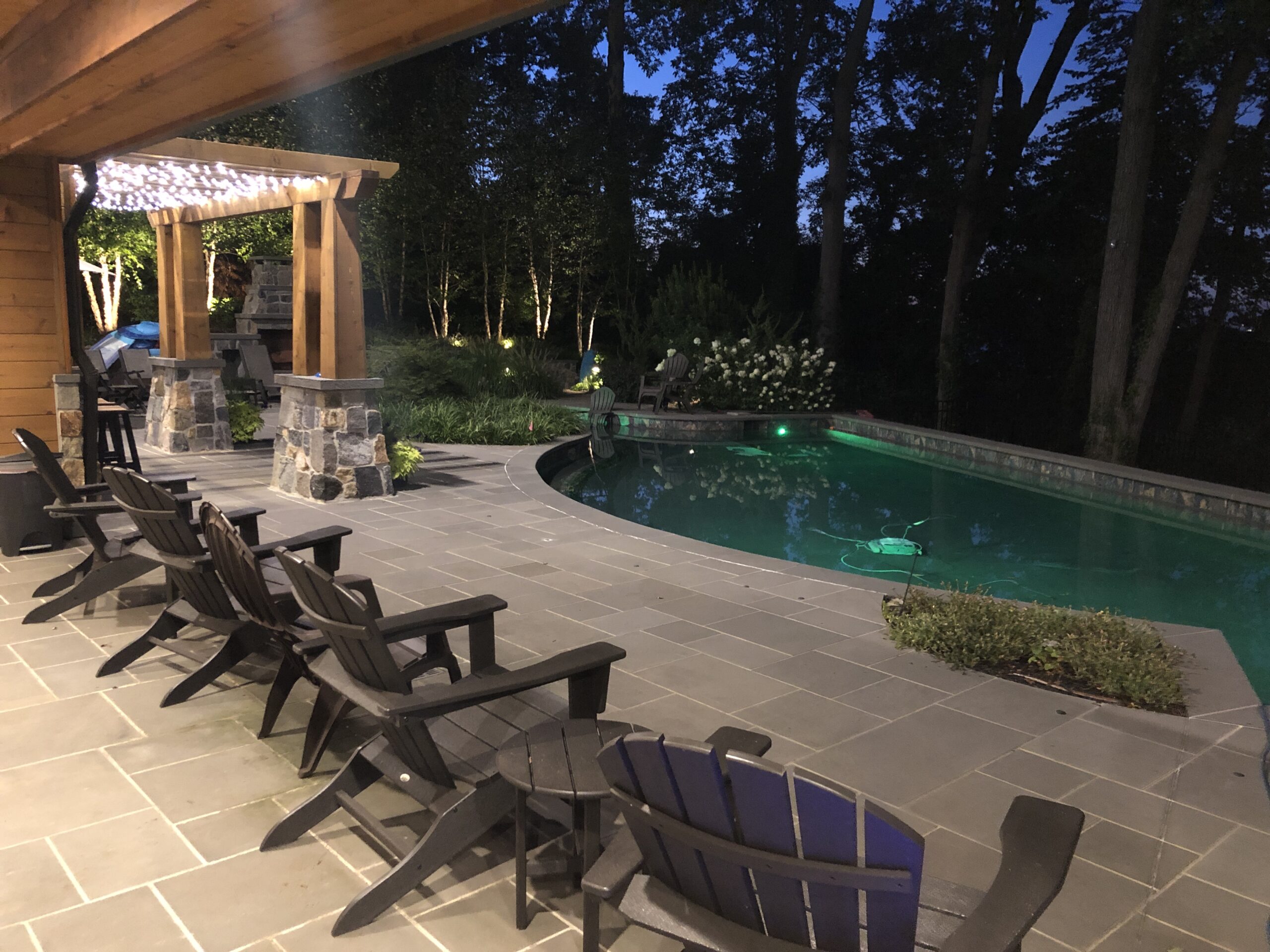 Adirondack chairs on pool patio